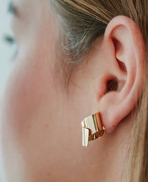 archi curve earrings golden brass